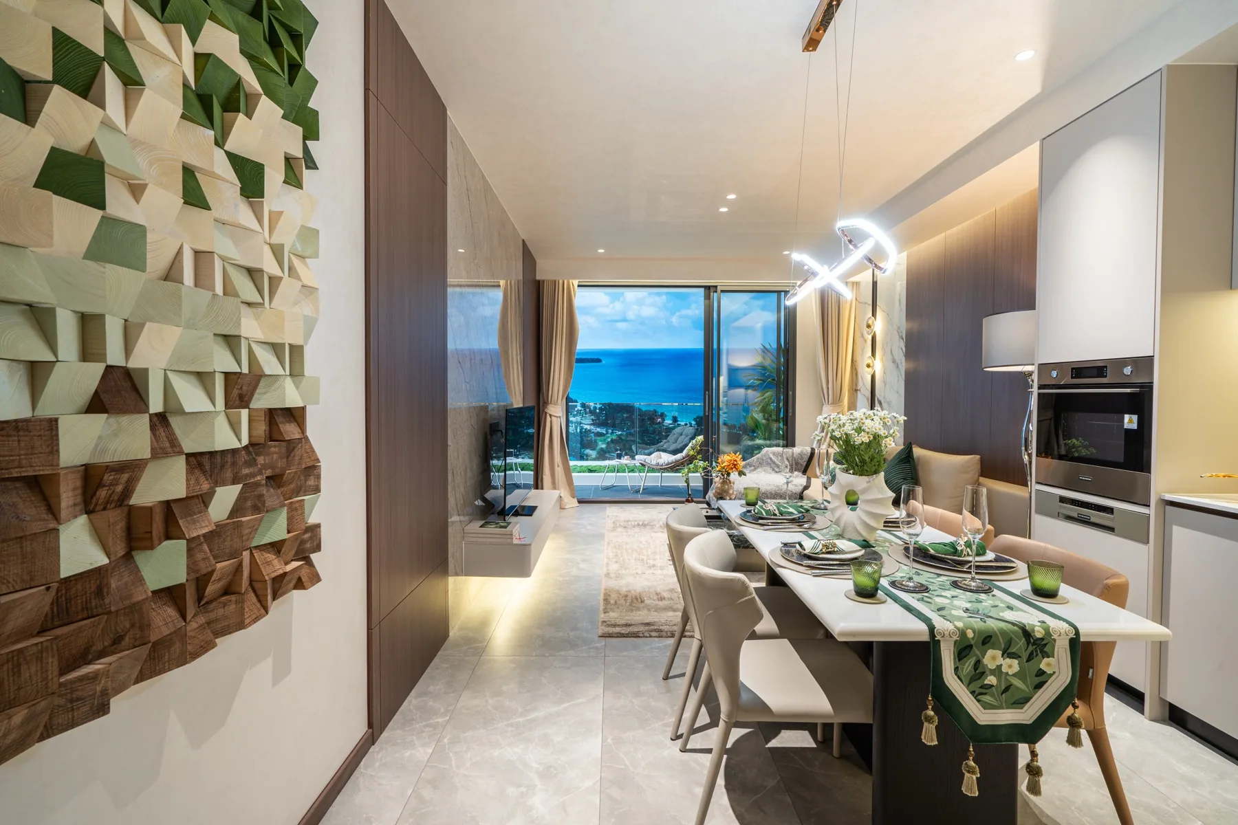 Dining area and kitchen in the AYANA Heights show residence