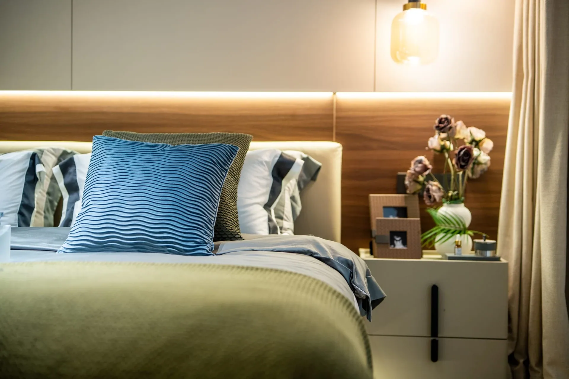Bedroom headboard, lighting and bedside furniture in the AYANA Heights show residence