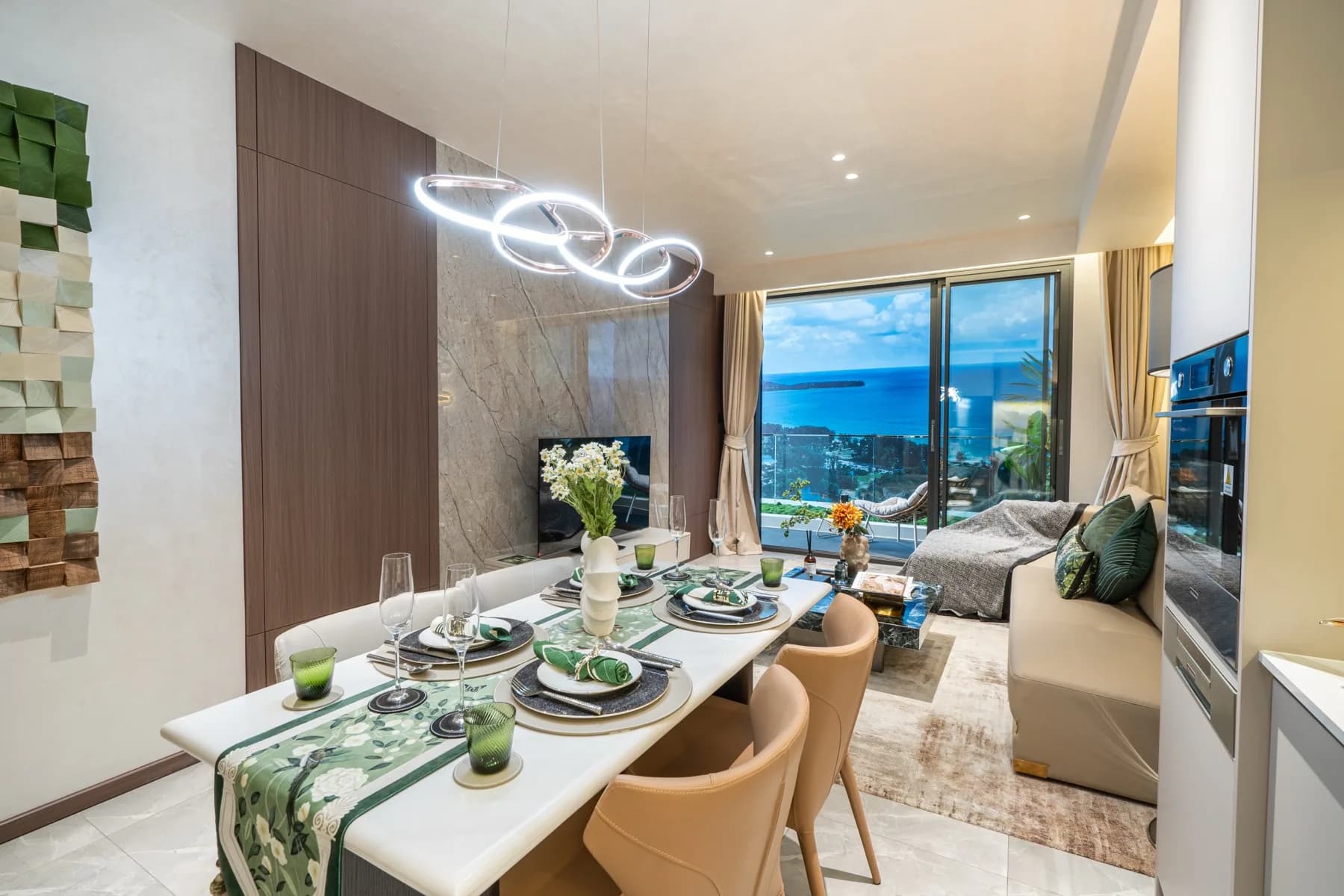 Dining table and living area in the AYANA Heights show residence